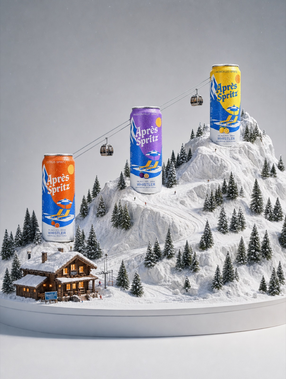 Aprés Spritz three-can lineup on snowy mountain diorama with gondola and chalet