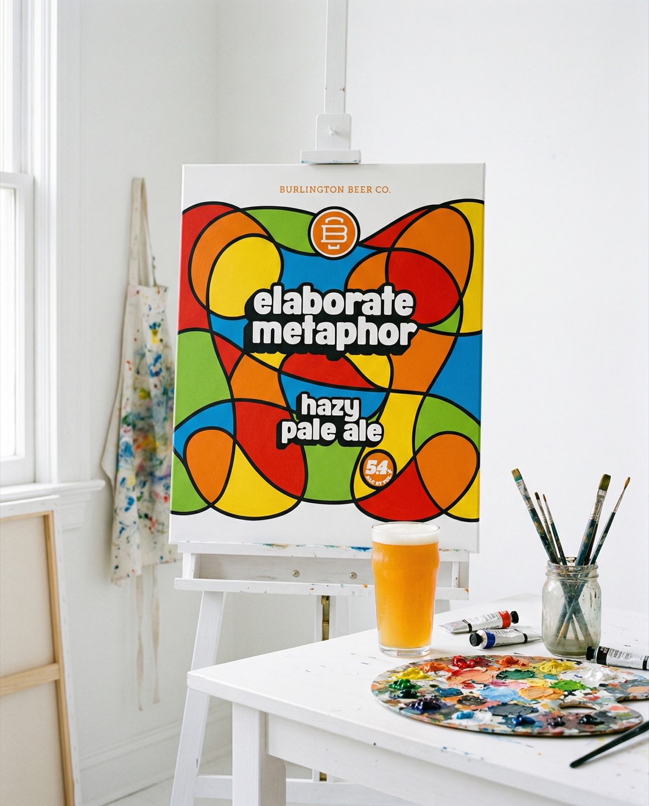 Burlington Beer Co. Elaborate Metaphor hazy pale ale with paint palette in artist studio