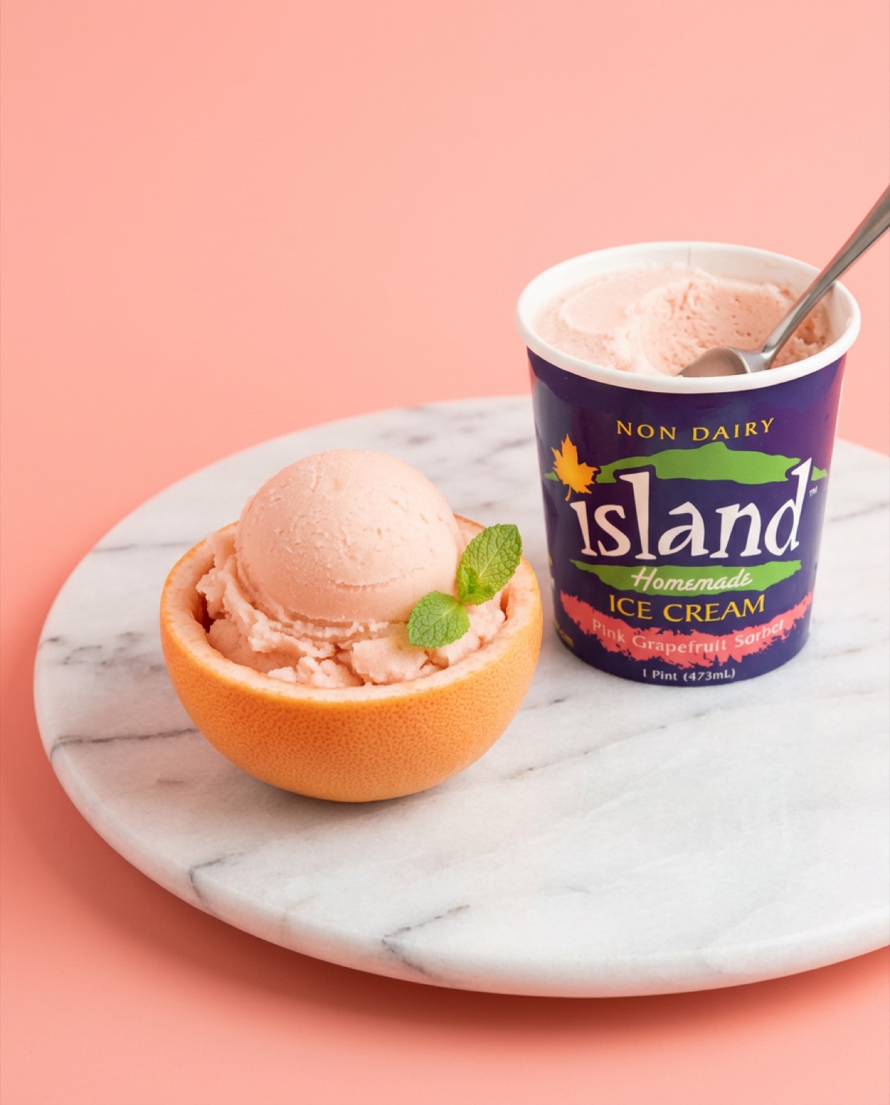 Island Homemade Ice Cream pink grapefruit sorbet in grapefruit half on marble