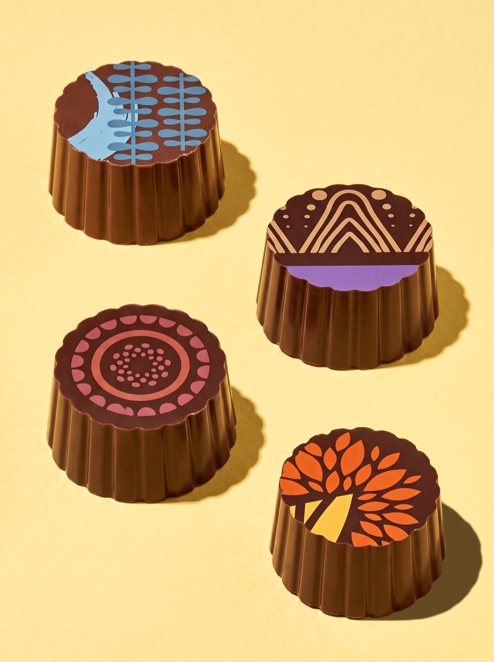 Birnn Chocolates Artisan box of four on warm yellow